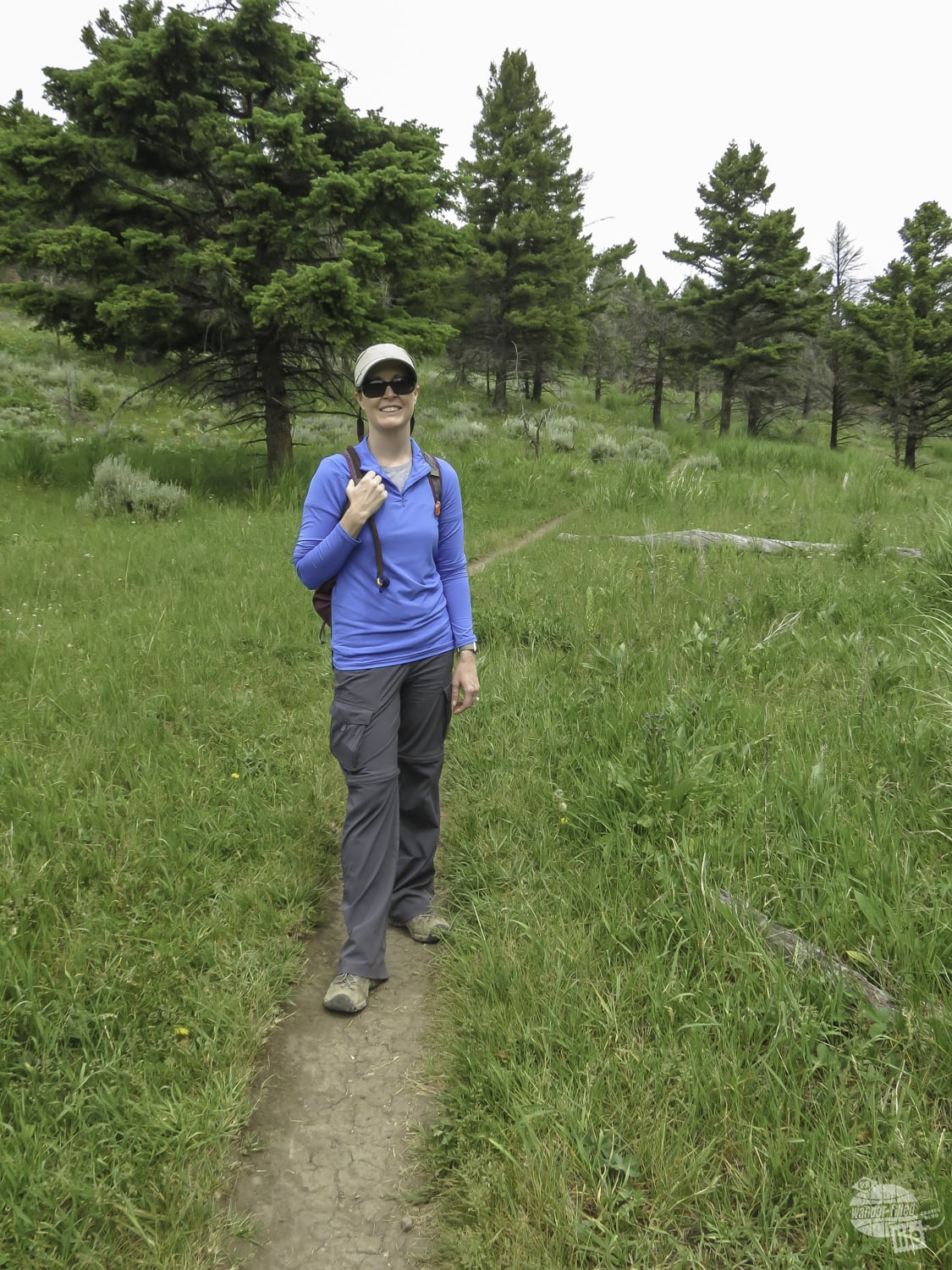 Bonnie on the trail in Yellowstone. Convertible pants are a great items for your Yellowstone packing list.