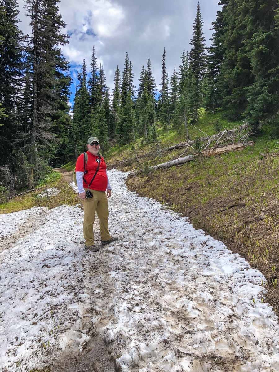 Grant crossing the snowfield on the trail.