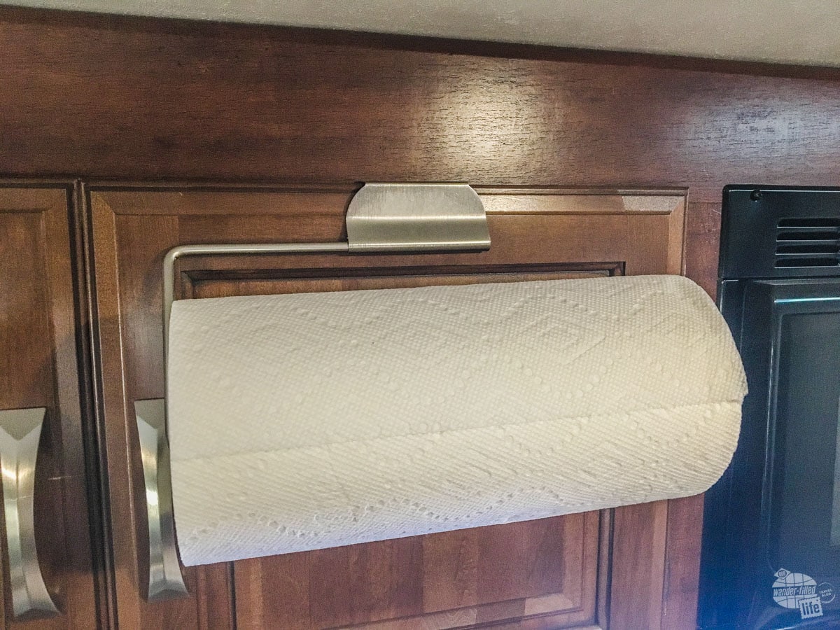 This paper towel holder fits on top of a cabinet door and is perfect for keeping your counter space clear.