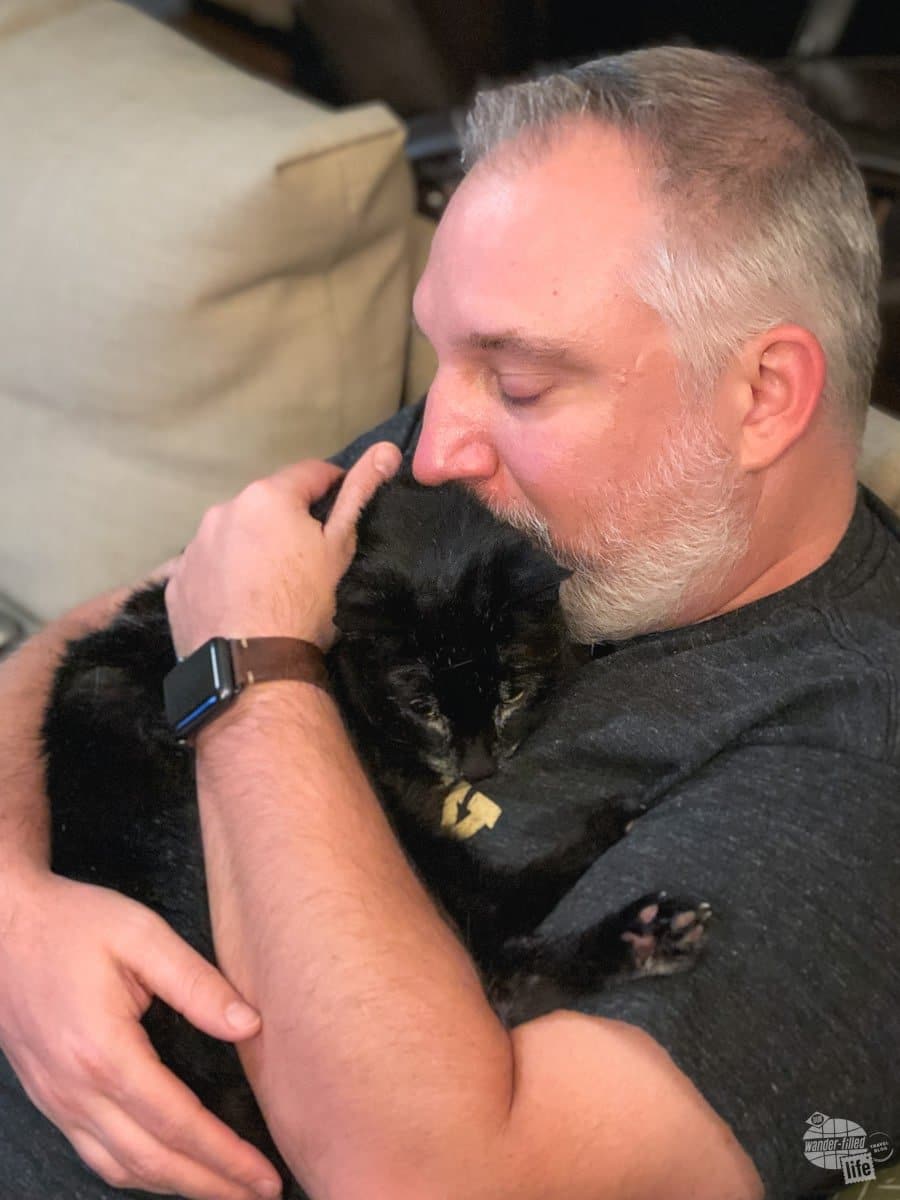 Grant snuggles with Alee after the visit to the vet.