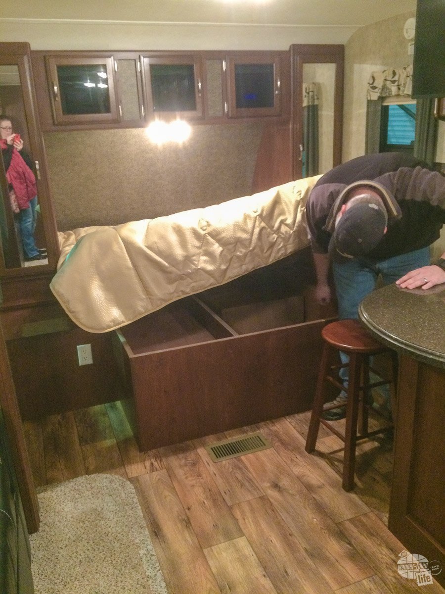 Grant checking out the under-bed storage of the 23RB. We ended up falling in love with this RV.