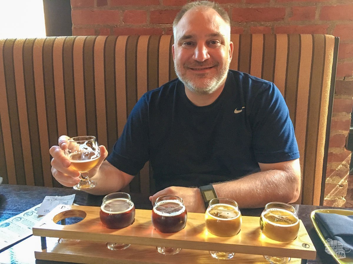 Grant enjoying a flight of beer at the Mill House Brewing Company.