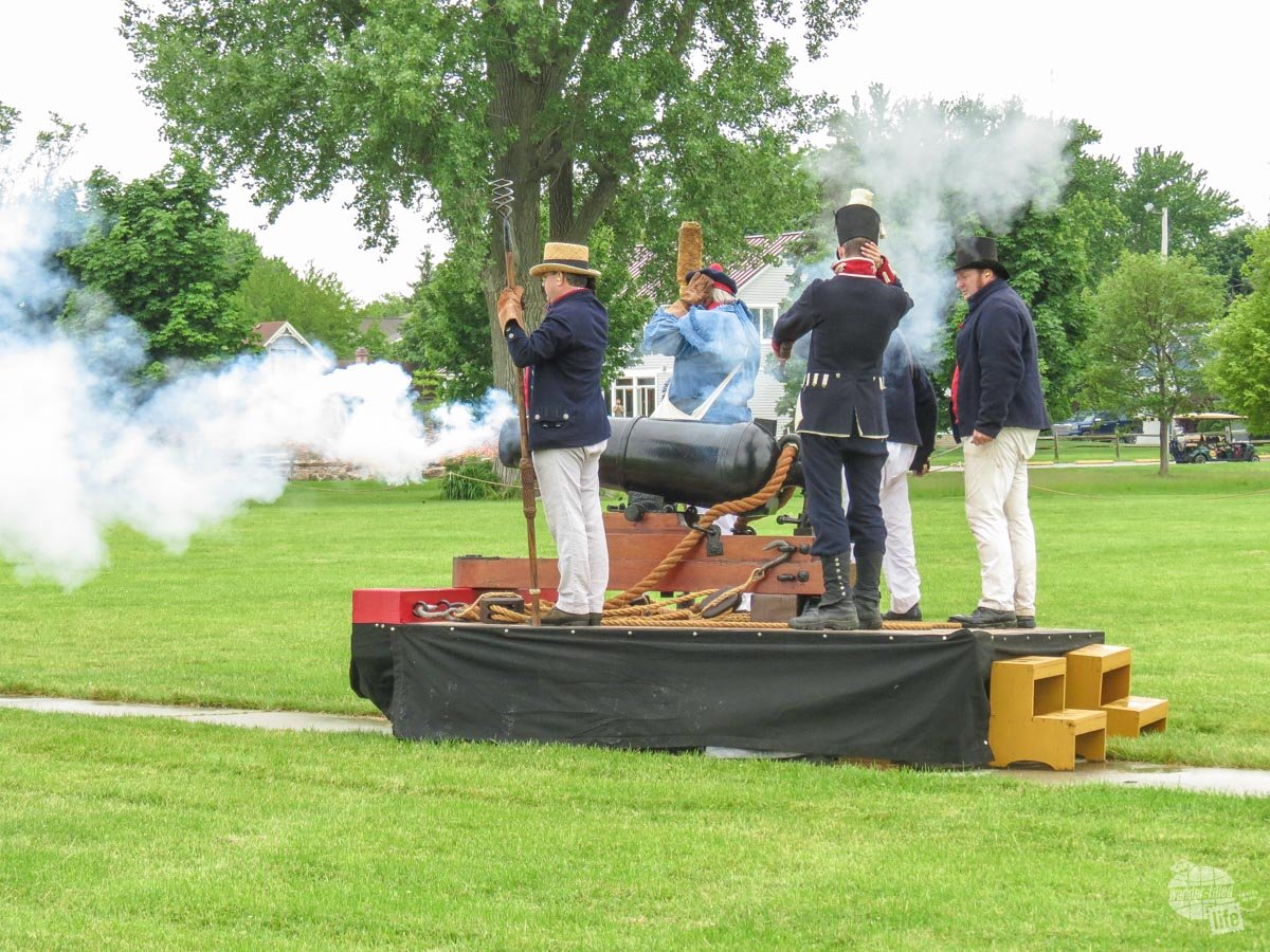 Park Service volunteers demonstrate the firing of a carronade. A carronade is basically a short range cannon, firing heavier projectiles but at half the range.