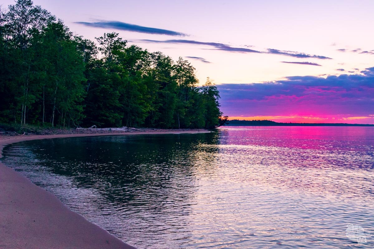 A pink and purple sky during a sunset over Lake Superior in Munising, MI.