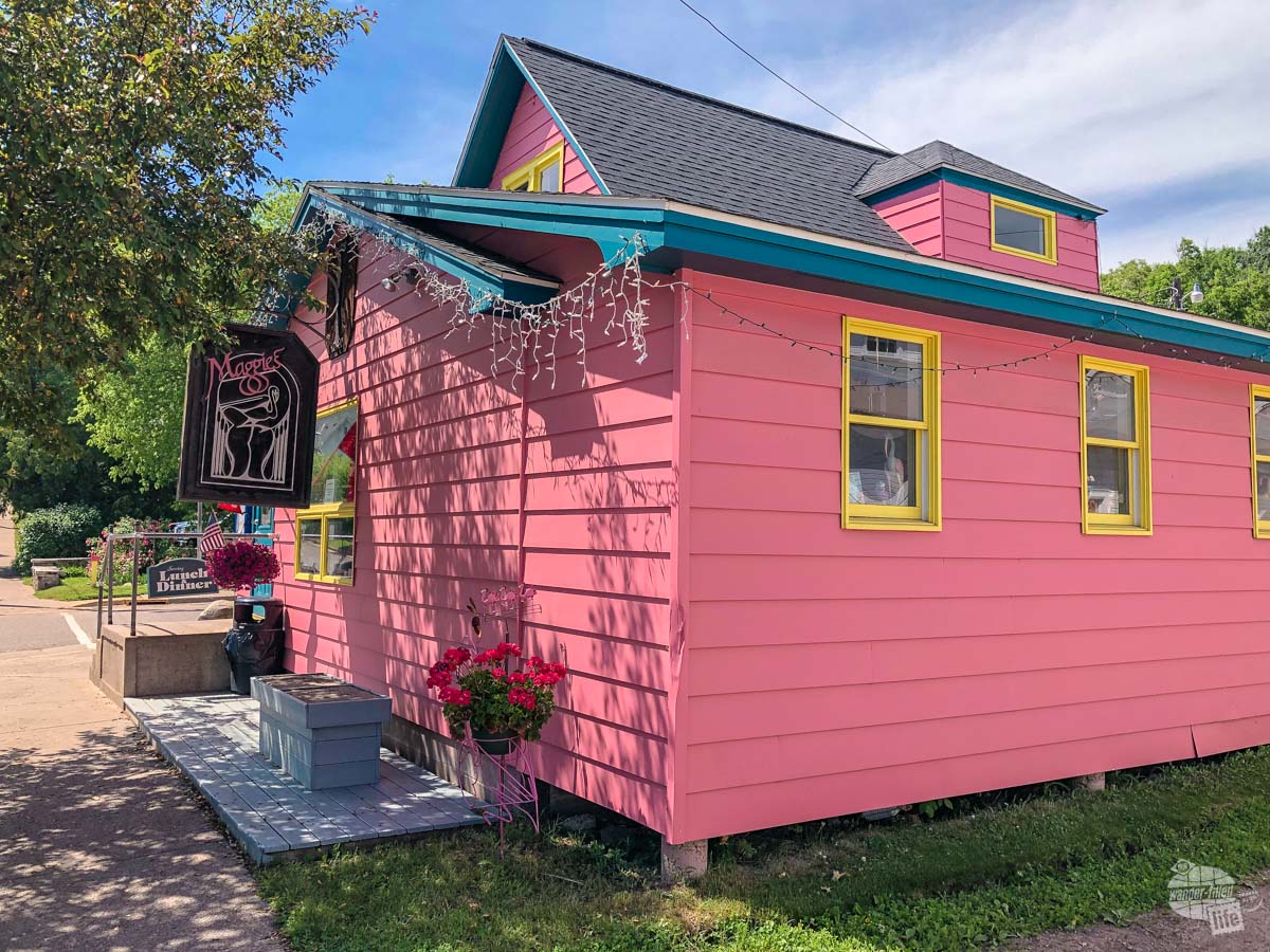 The bright pink building for Maggie's, a restaurant in Bayfield, WI.