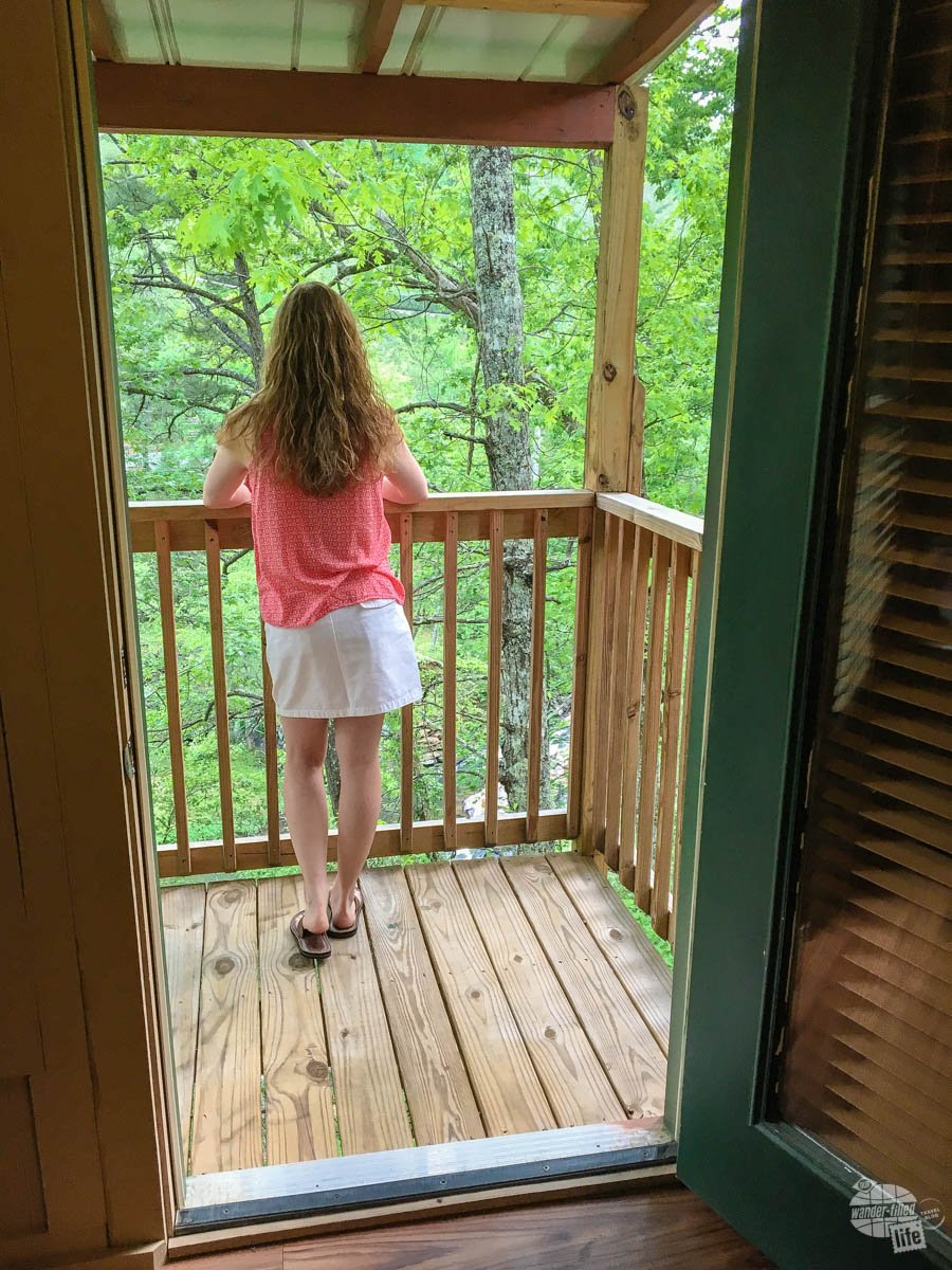 Bonnie enjoying the view from the deck of the treehouse.