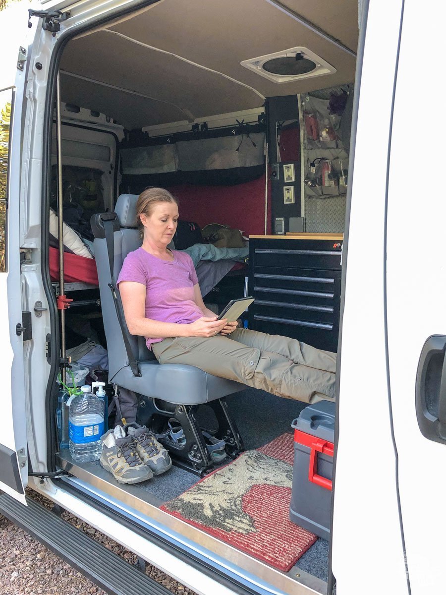 Bonnie reading in the camper van.