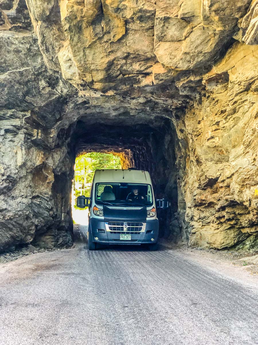 Our Denver Camper Van rental driving through the tunnels on the Needles Highway near Custer, SD.