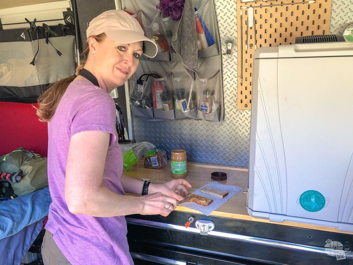 Bonnie making lunch in the camper van.