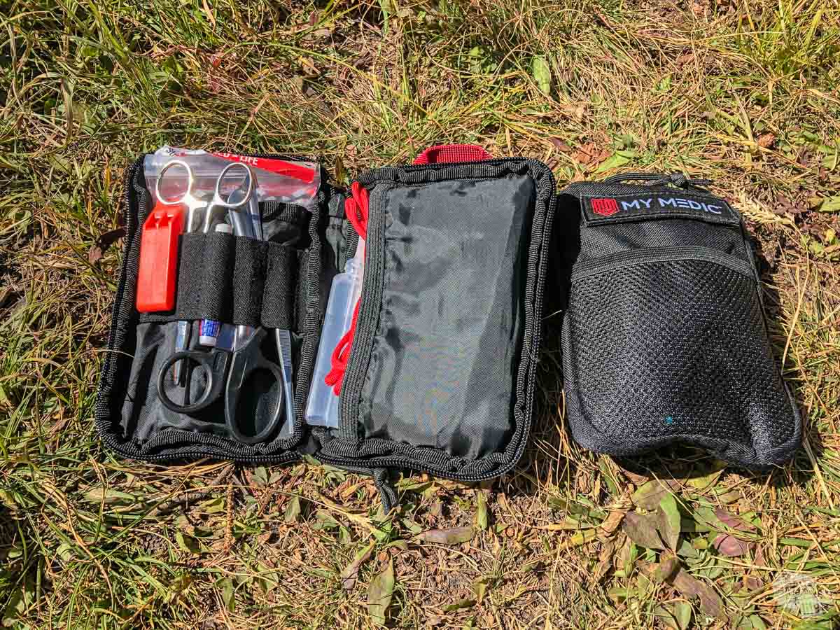 MyMedic Advanced and Basic kits. The kits are relatively compact and have a lot useful gear, including an emergency whistle and paracord on top of the medical gear.