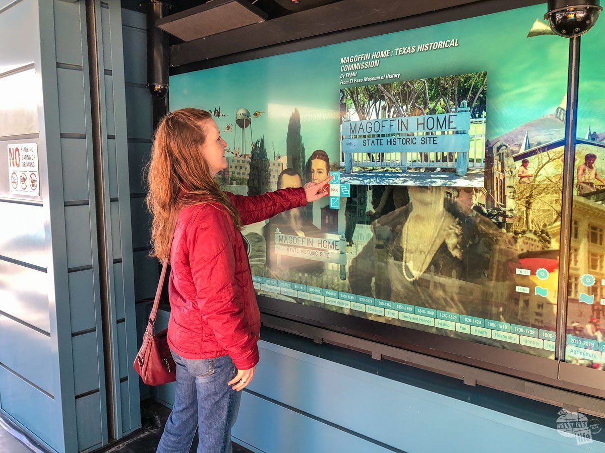 Bonnie uses the digital wall in El Paso to learn about other sites in town. 