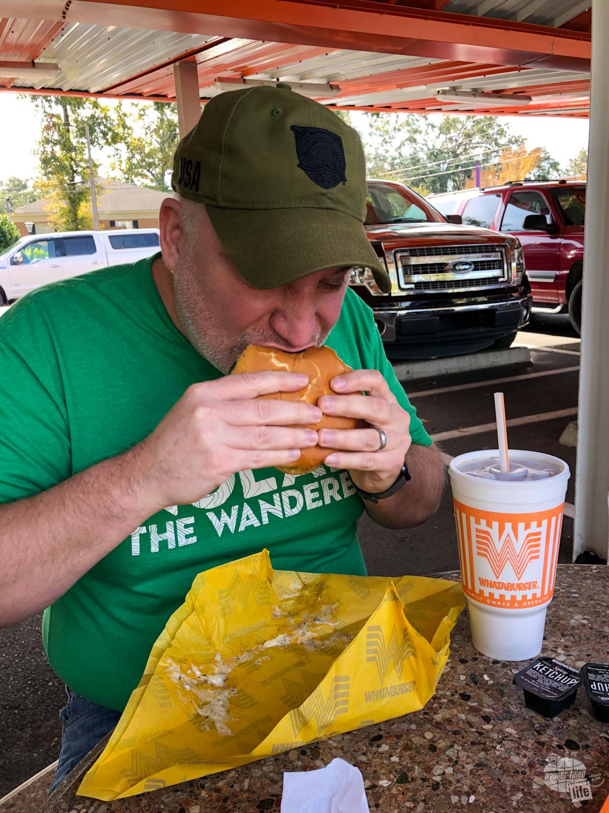 Grant enjoying a burger at Whataburger.