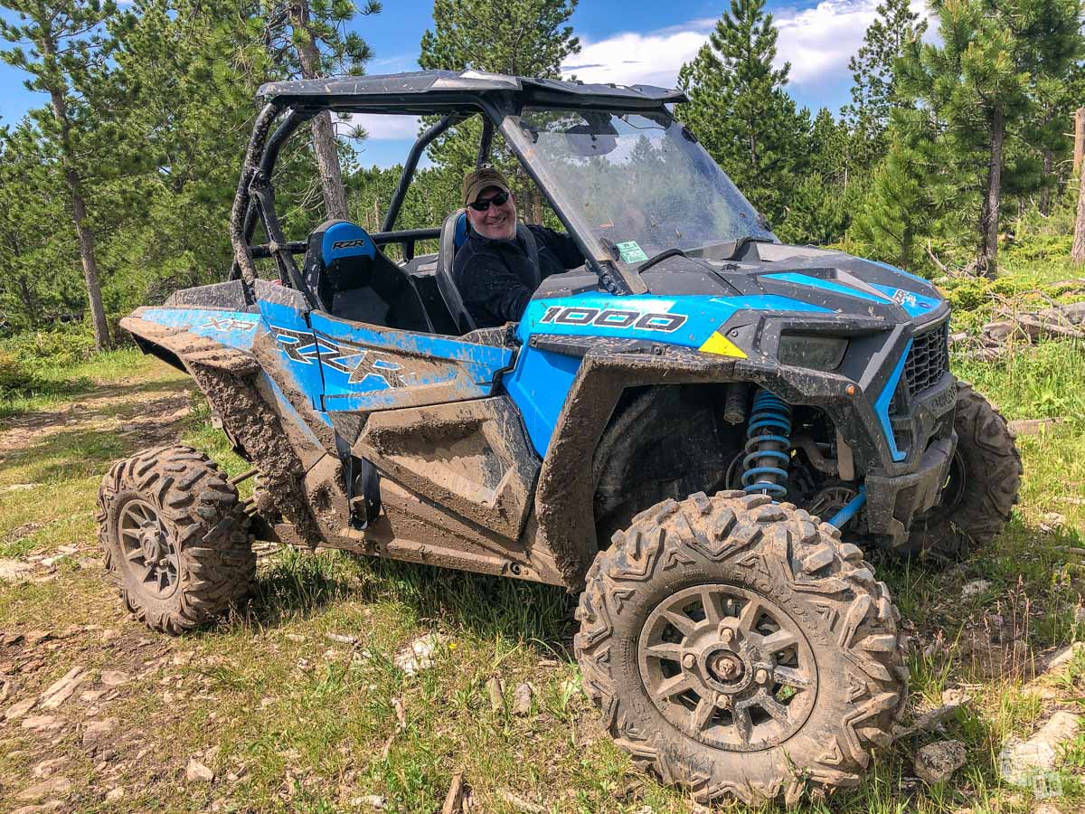 Grant is ready to get some mud on the tires of our ATV rental.