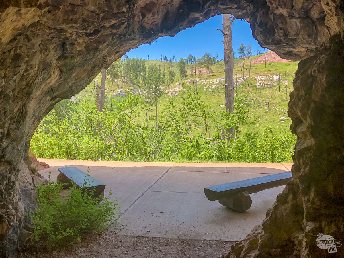 This small cave provides a place in the shade along the trail to the natural entrance.