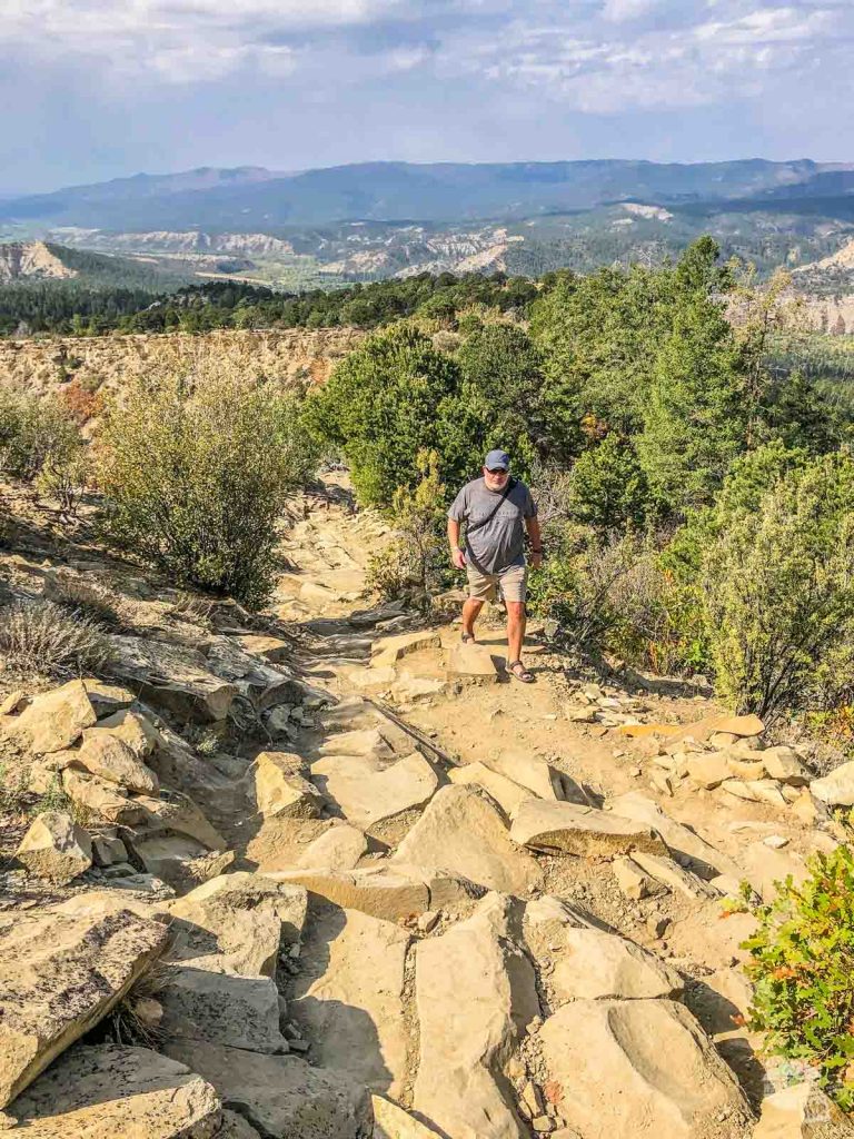 Grant hiking up the Chimney Rock Great Pueblo Trail.