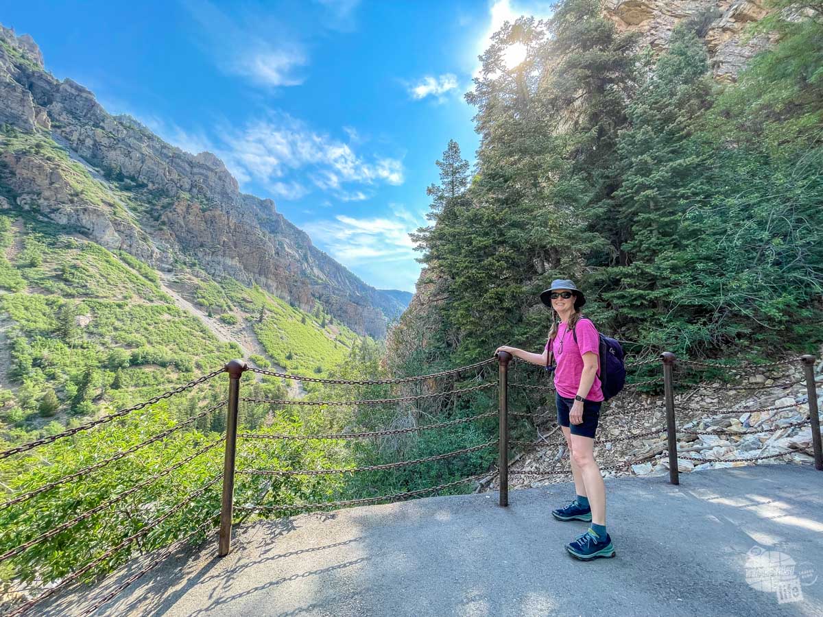 Bonnie looks at American Fork Canyon on the hike up to Timpanogos Cave.
