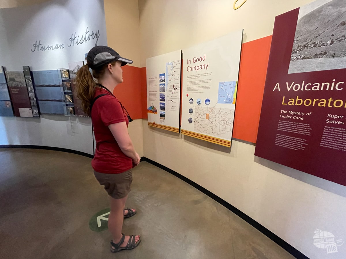 Bonnie reads an exhibit at Kohm Yah-ma-nee Visitor Center on the volcanic landscape in Lassen Volcanic National Park.