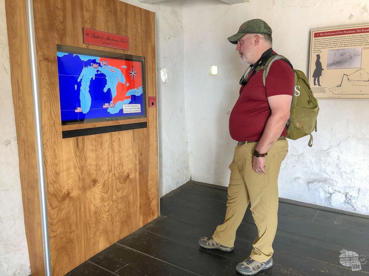 Grant watching a video at Fort Mackinac to learn about its history.