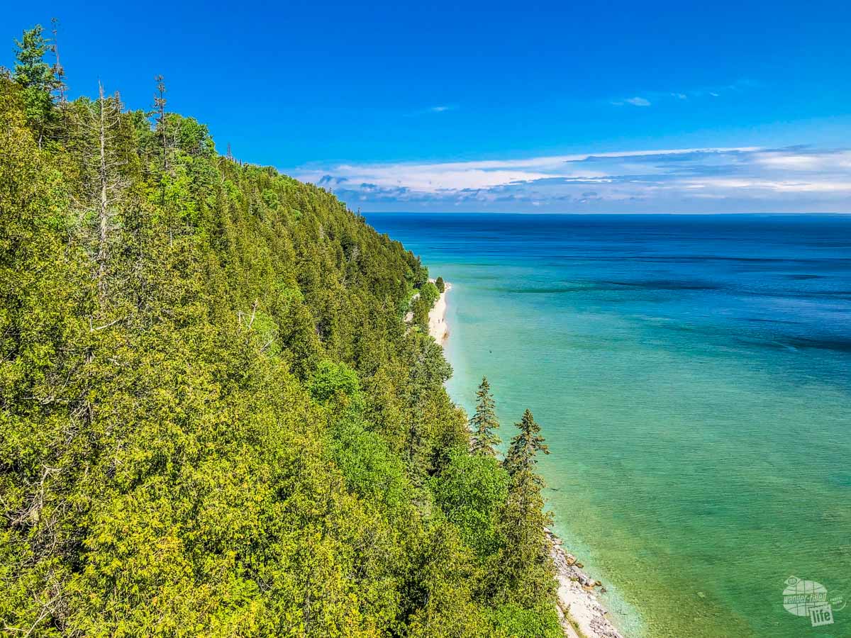 Blue-green waters of Lake Huron and the coastline of Mackinac Island.