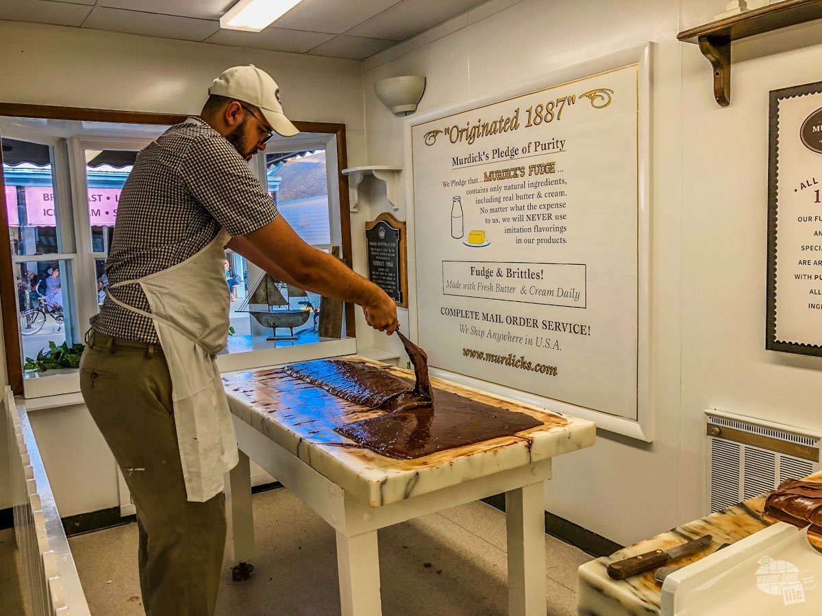 A worker makes fudge at Murdick's on Mackinac Island. 